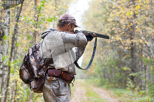 Image of hunter taking aim from a shotgun in the wildfowl