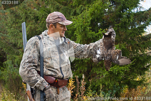 Image of hunter with hunting trophy