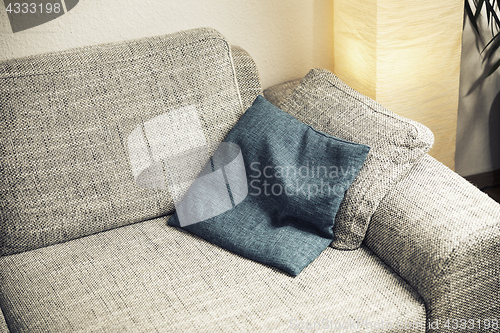 Image of sofa with a cushion