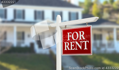 Image of For Rent Real Estate Sign In Front of Beautiful House