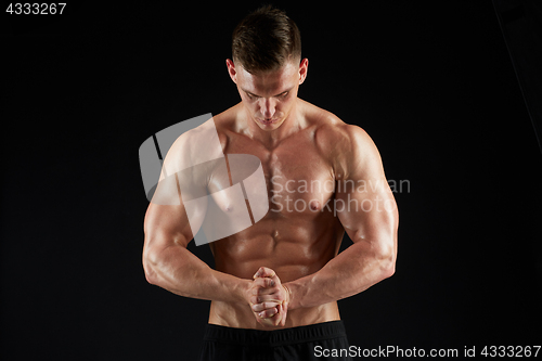 Image of young man or bodybuilder with bare torso