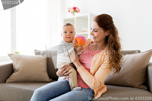 Image of happy young mother with little baby at home