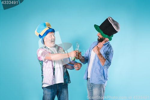 Image of The two football fans over blue