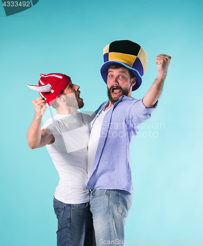 Image of Two Excited Male Friends Celebrate Watching Sports