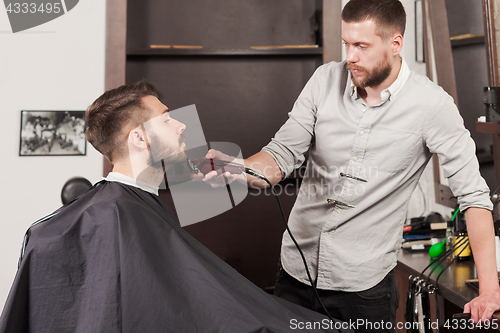 Image of Hipster client visiting barber shop