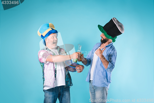 Image of The two football fans over blue