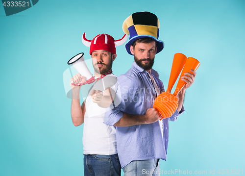 Image of The two football fans over blue