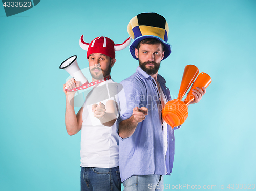Image of The two football fans over blue