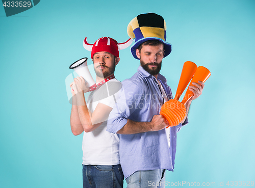 Image of The two football fans over blue