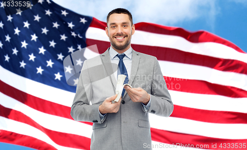 Image of smiling businessman with american dollar money