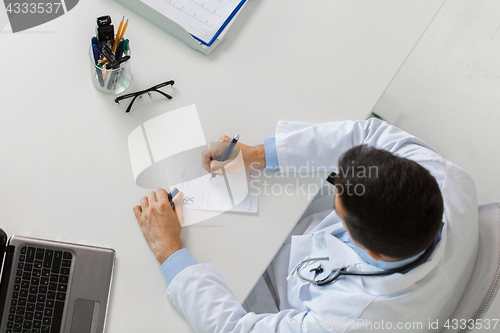 Image of doctor hands with prescription at clinic