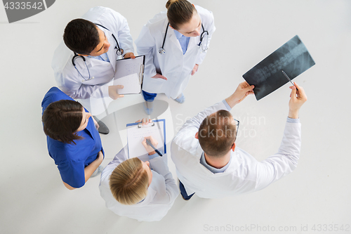 Image of doctors with spine x-ray and clipboards