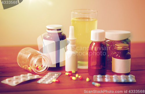 Image of medicine and drugs on wooden table