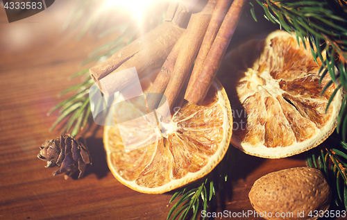 Image of christmas fir branch, cinnamon and dried orange