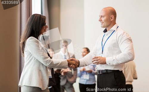 Image of handshake of people at business conference