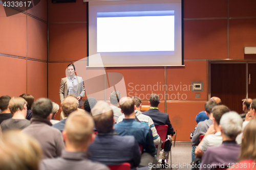 Image of Speaker Giving a Talk at Business Meeting.