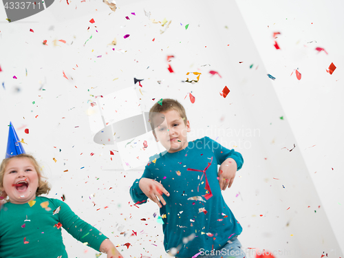 Image of kids  blowing confetti