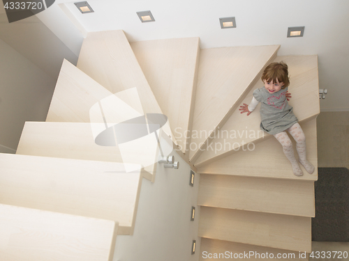 Image of little cute girl enjoying on the stairs