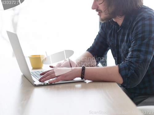 Image of man working from home