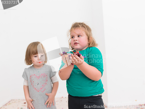 Image of kids  blowing confetti