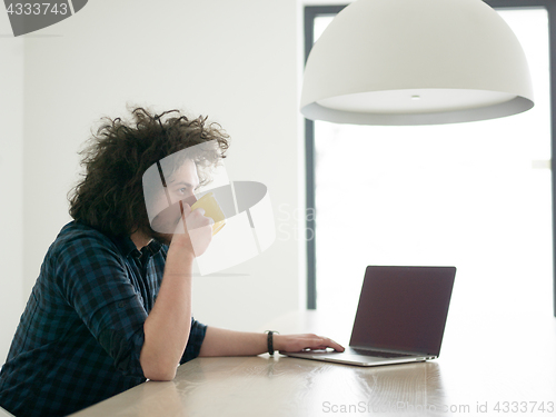 Image of man working from home