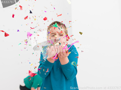 Image of kids  blowing confetti