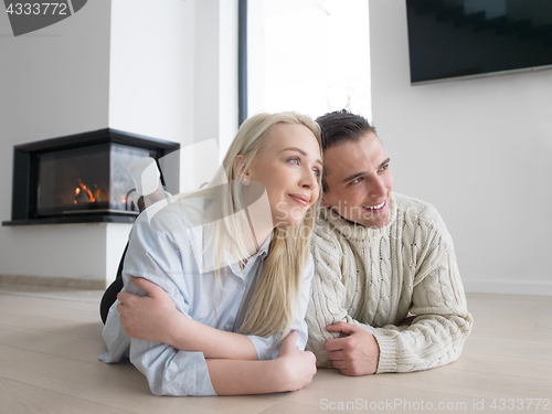 Image of Young Couple using digital tablet on cold winter day