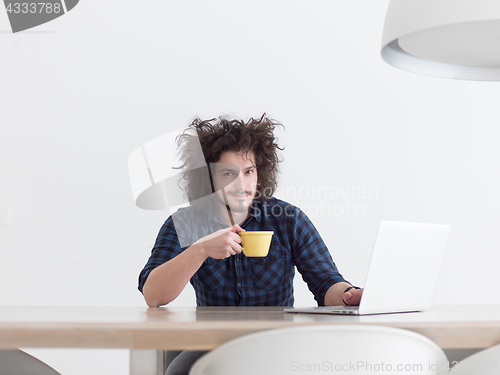 Image of man working from home