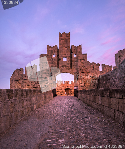 Image of The fortress wall in the harbor at sunset. Rhodes