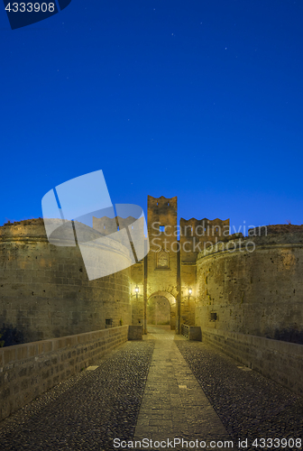 Image of The fortress wall in the harbor at sunset. Rhodes