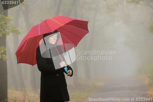 Image of Woman with red umbrella 