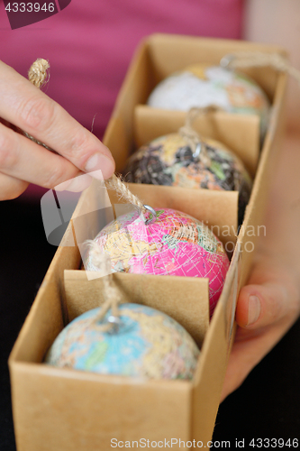 Image of Christmas balls shaped as globe or planet