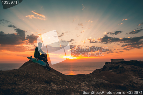 Image of Skater boy at sunset