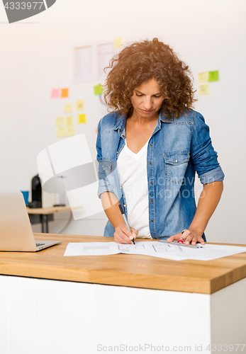 Image of Woman working at the office