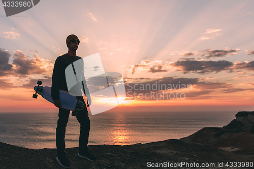 Image of Skater boy at sunset