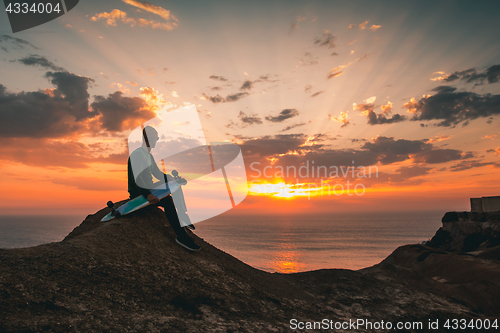 Image of Skater boy at sunset