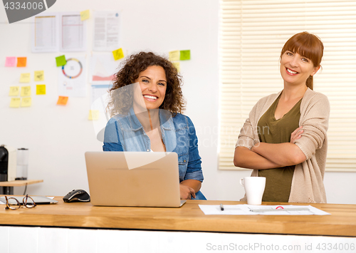 Image of Two businesswoman working together