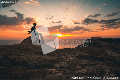 Image of Skater boy at sunset