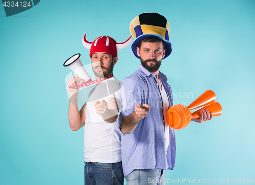 Image of The two football fans over blue