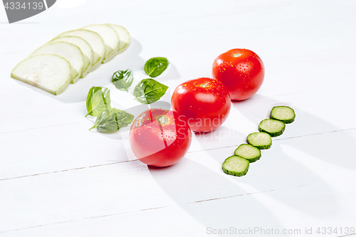 Image of The fresh tomatos on white background