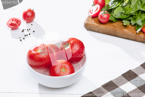 Image of The fresh tomatos on white background