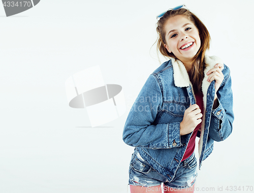 Image of young pretty teenage hipster girl posing emotional happy smiling on white background, lifestyle people concept 