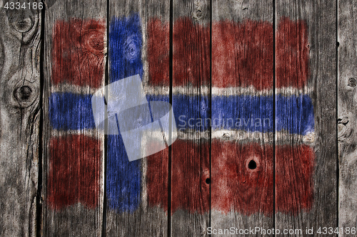 Image of norwegian flag on aged wooden wound