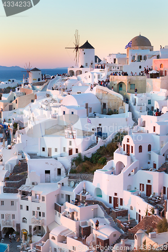 Image of Oia village at sunset, Santorini island, Greece.