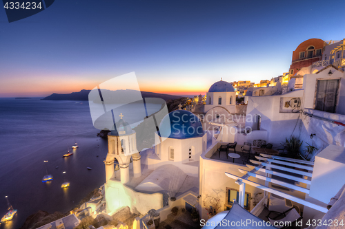 Image of Traditional greek village of Oia at dusk, Santorini island, Greece.