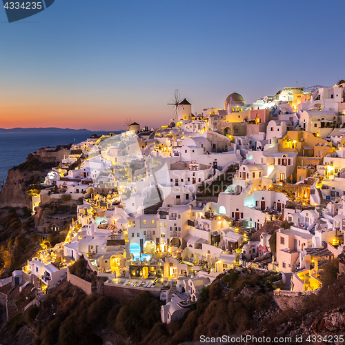 Image of Oia village at sunset, Santorini island, Greece.