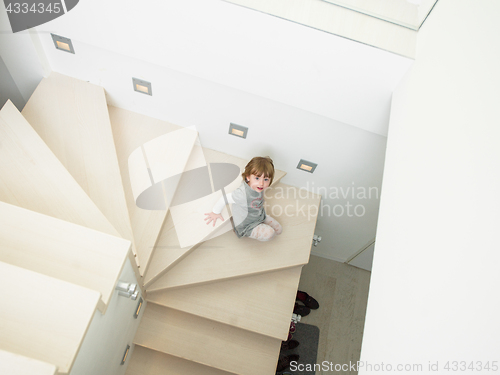 Image of little cute girl enjoying on the stairs