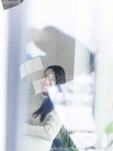 Image of asian woman enjoying at home