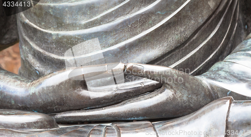 Image of Detail of Buddha statue with Dhyana hand position, the gesture o