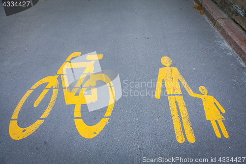 Image of Bicycle signs painted on asphalt